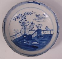 Lot 379 - A Lowestoft porcelain saucer, underglaze blue...