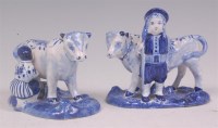 Lot 386 - A pair of 19th century Dutch delft cows, each...