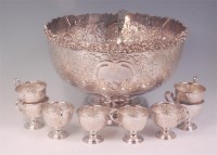 Lot 409 - A silver plated punch bowl and accessories by...