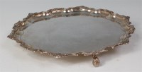 Lot 414 - A George V silver salver, having raised and...