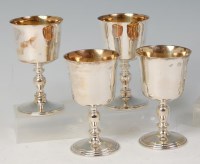 Lot 416 - A set of four modern silver pedestal goblets,...