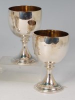 Lot 417 - A pair of modern silver pedestal goblets, on...