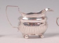 Lot 419 - A George III silver cream jug, of half reeded...