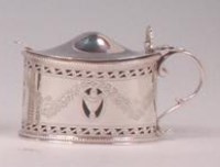 Lot 422 - A George V silver mustard pot and cover, of...