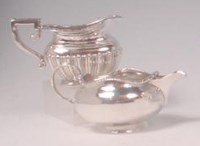 Lot 424 - An Edwardian silver cream jug, of half reeded...