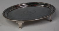 Lot 445 - A George III silver teapot stand, of oval form,...