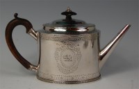 Lot 446 - A George III silver teapot, of beaded oval...