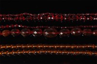 Lot 474 - A beaded orange amber long necklace, with twin...