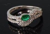 Lot 475 - A ladies contemporary 14ct white gold emerald...