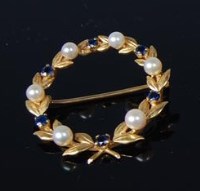 Lot 488 - A 9ct gold sapphire and seed pearl set wreath...