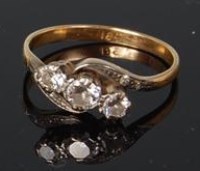 Lot 508 - A ladies 18ct yellow gold diamond three stone...