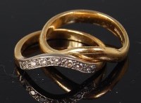 Lot 530 - An 18ct gold wishbone wedding band, with...