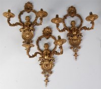 Lot 542 - A set of three gilt bronze two branch wall...