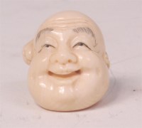 Lot 598 - A Japanese Meiji period carved ivory netsuke,...