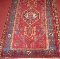 Lot 700 - A Kurdish woollen rug, having a poled field...