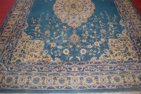 Lot 702 - A Persian woollen blue ground carpet, having a...