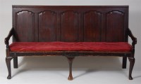 Lot 709 - An 18th century joined oak five-panel settle,...