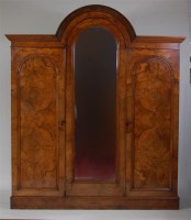 Lot 728 - A Victorian figured walnut dome-top wardrobe,...