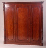 Lot 748 - An early Victorian mahogany triple wardrobe,...