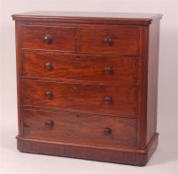 Lot 750 - A Victorian mahogany round corner chest of two...