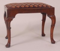 Lot 764 - An early 18th century walnut stool, having a...