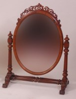 Lot 785 - A Victorian walnut toilet mirror, the oval...