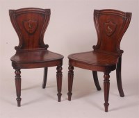 Lot 790 - A pair of George IV mahogany hall chairs, the...