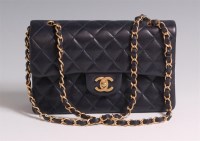 Lot 67 - A Coco Chanel navy blue leather quilted Flap...
