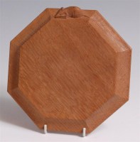 Lot 74 - A 'Mouseman' carved light oak cheese dish, of...