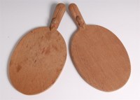 Lot 75 - A pair of 'Mouseman' light oak cheeseboards,...