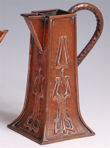 Lot 79 - An Art Nouveau hammered copper single handled...