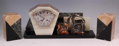 Lot 43 - A French Art Deco three piece marble onyx and...