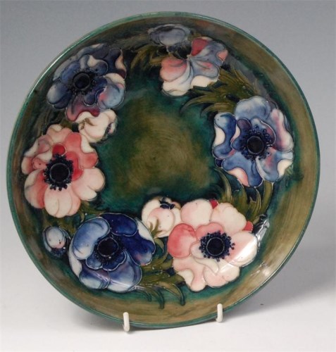 Lot 5 - An early 20th century Moorcroft painted and...