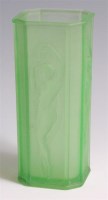 Lot 11 - A French Art Deco press moulded green glass...