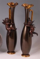 Lot 114 - A pair of Art Nouveau bronzed and gilt metal...