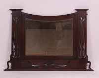 Lot 221 - An Art Nouveau oak overmantel mirror, having...