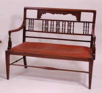 Lot 229 - A Liberty's design walnut two seater settle,...