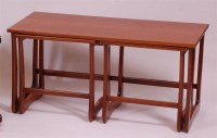 Lot 243 - A 1970s teak nest of three occasional tables,...