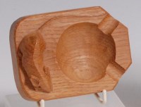 Lot 73 - A 'Mouseman' carved light oak ashtray, having...