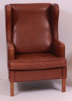 Lot 268 - After Borge Mogensen - A tan leather wingback...