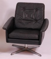 Lot 269 - A 1960s Danish black leather swivel armchair,...
