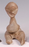 Lot 134 - A contemporary African carved soapstone seated...
