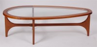 Lot 287 - A 1970s teak framed coffee table, of teardrop...