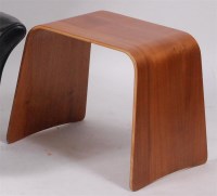Lot 256 - A 1970s curved plywood side table, h.45cm,...