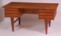 Lot 271 - A 1960s Danish teak kneehole writing desk,...