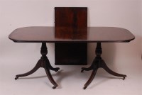 Lot 865 - A mahogany twin pedestal dining table, in the...