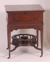 Lot 886 - An Edwardian oak surprise cocktail table by...