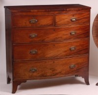 Lot 897 - A Regency mahogany bowfront chest, of two...