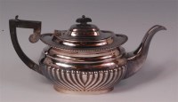 Lot 465 - A late Victorian silver teapot, of half reeded...