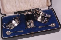 Lot 469 - An Edwardian cased silver three piece cruet...